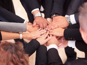 Group Of Business People With Their Hands Together